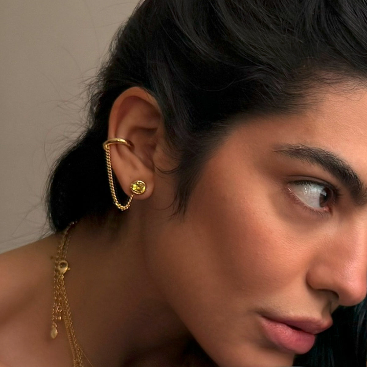 BRINCO PIERCING OLHO GIPSY DOURADO